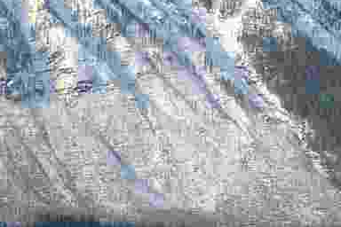 Matching trees and mountain texture after the size search, showing lost fine detail.